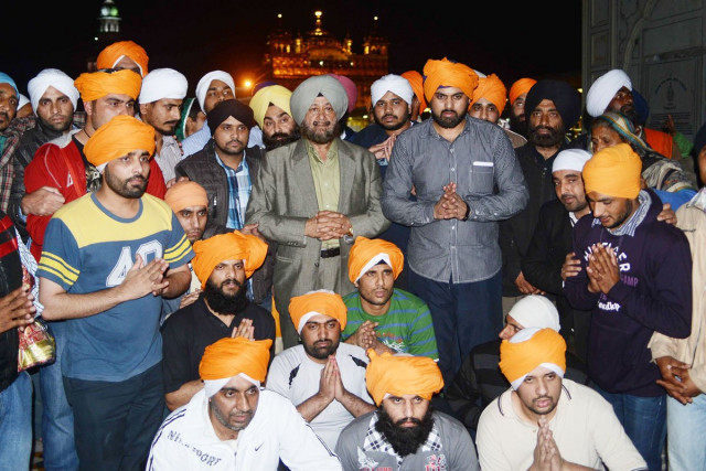released indian prisoners pose with dubai based hotelier sp singh oberoi c who helped secure their release pose for a photo at the sikh shrine golden temple in amritsar photo afp released indian prisoners pose with dubai based hotelier sp singh oberoi c who helped secure their release pose for a photo at the sikh shrine golden temple in amritsar photo afp