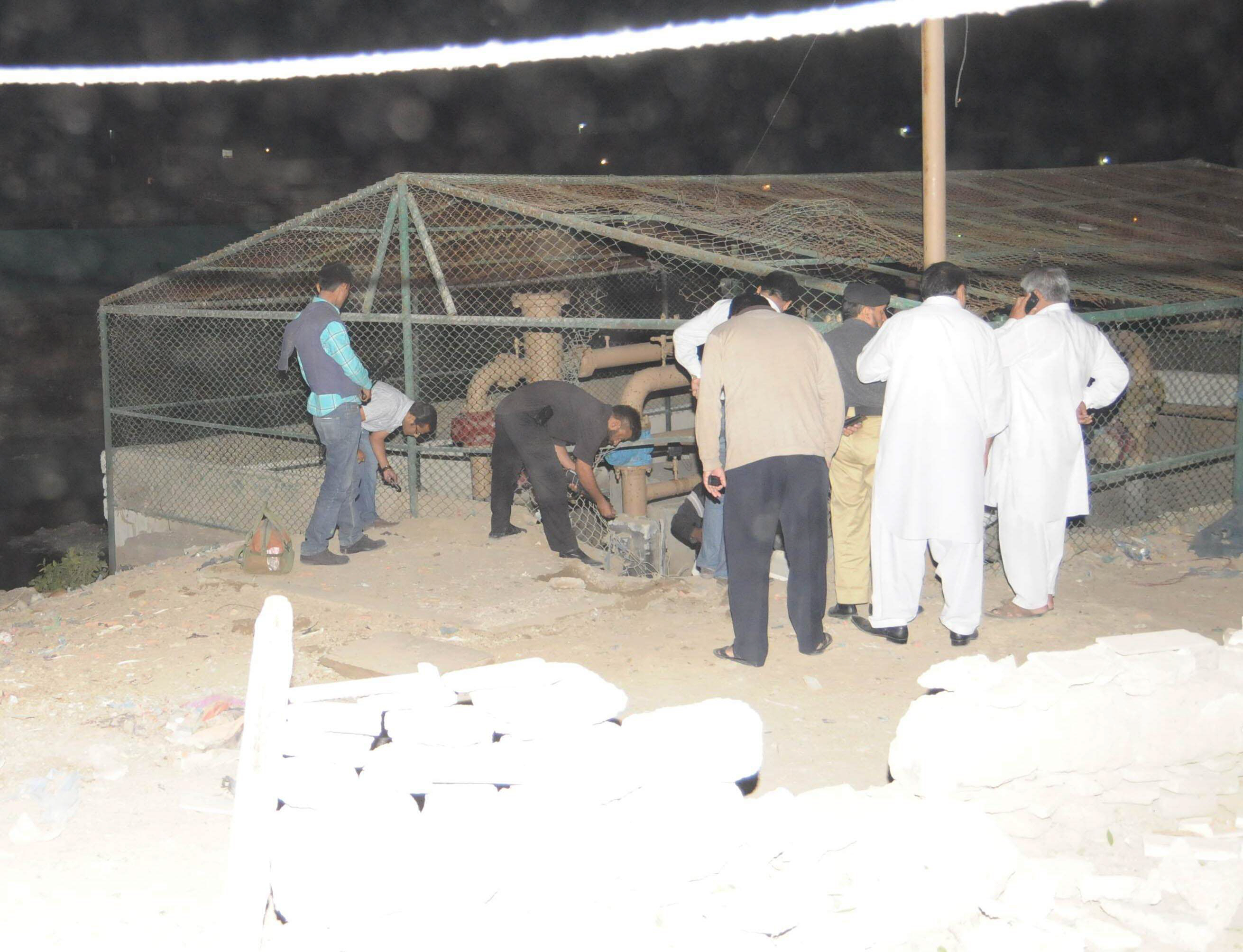 bomb disposal squad officials inspect the site of the blast at qayyumabad on monday photo express