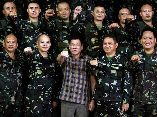 philippine president rodrigo duterte makes a quot fist bump quot his may presidential elections campaign gesture with soldiers during a visit at capinpin military camp in tanay rizal in the philippines august 24 2016 photo erik de castro reuters philippine president rodrigo duterte makes a quot fist bump quot his may presidential elections campaign gesture with soldiers during a visit at capinpin military camp in tanay rizal in the philippines august 24 2016 photo erik de castro reuters