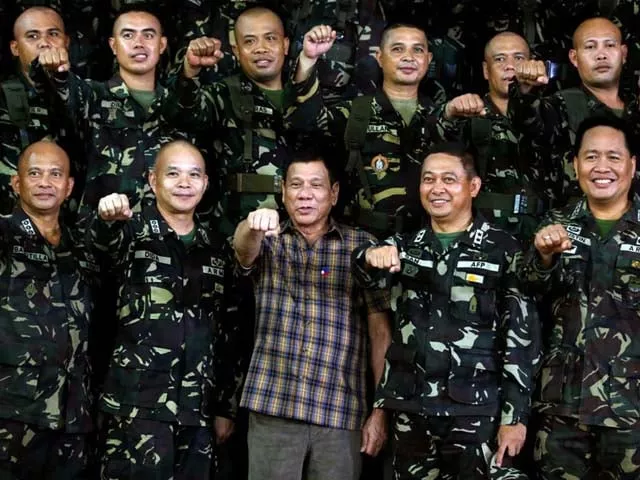 philippine president rodrigo duterte makes a quot fist bump quot his may presidential elections campaign gesture with soldiers during a visit at capinpin military camp in tanay rizal in the philippines august 24 2016 photo erik de castro reuters philippine president rodrigo duterte makes a quot fist bump quot his may presidential elections campaign gesture with soldiers during a visit at capinpin military camp in tanay rizal in the philippines august 24 2016 photo erik de castro reuters
