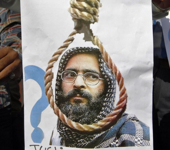 a poster carrying photo of afzal guru photo reuters a poster carrying photo of afzal guru photo reuters