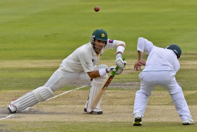 south africa fielder dean elgar jumps out of the way as misbahul haq hits the ball on day three of the first test match between south africa and pakistan in johannesburg at wanderers stadium photo afp south africa fielder dean elgar jumps out of the way as misbahul haq hits the ball on day three of the first test match between south africa and pakistan in johannesburg at wanderers stadium photo afp