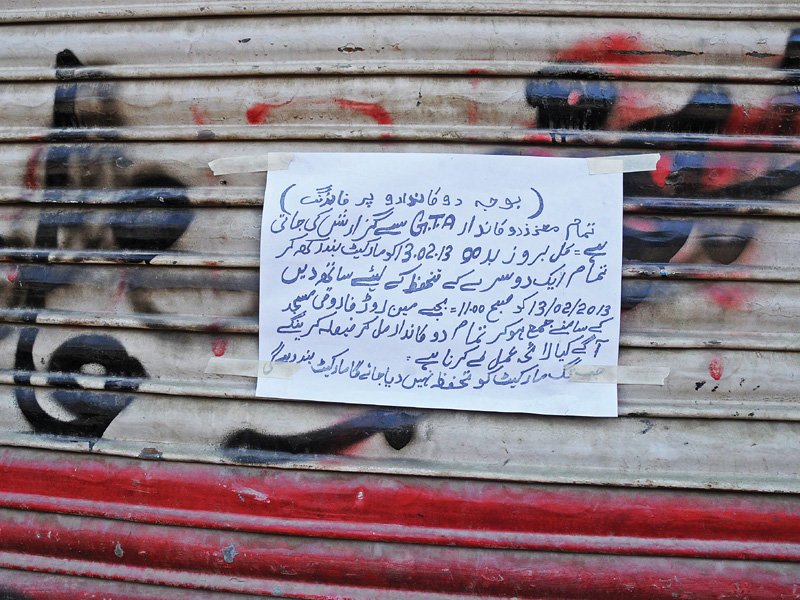 several notices have been put up outside shops in gulbahar s sanitary market advising traders to keep their businesses closed photo express