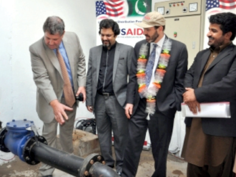 officials of cda and usaid at the inaugration of one of the tube wells photo file