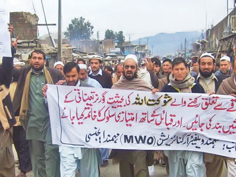 people from the tribal belt take to the streets in support of governor shaukatullah khan photo express