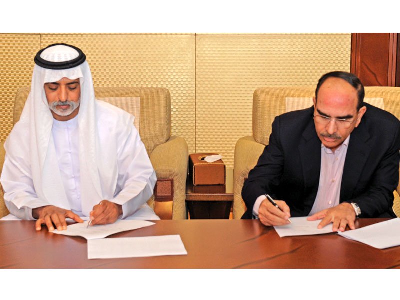 sheikh nahyan bin mubarak al nahyan and malik riaz sign the investment agreement in abu dhabi photo press release