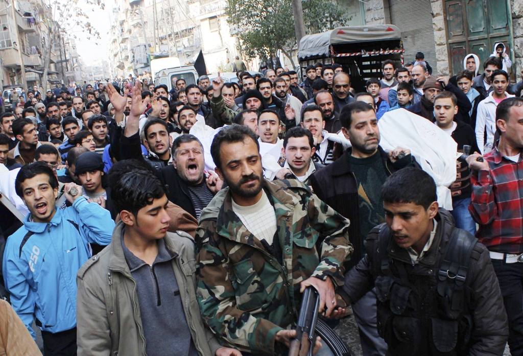 people chant slogans against syria 039 s president bashar al assad during a funeral in bustan al qasr district in aleppo photo reuters