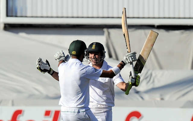 south african cricketers dean elgar and robin peterson celebrate winning the second test between south africa and pakistan in cape town at newlands on february 17 2013 photo afp