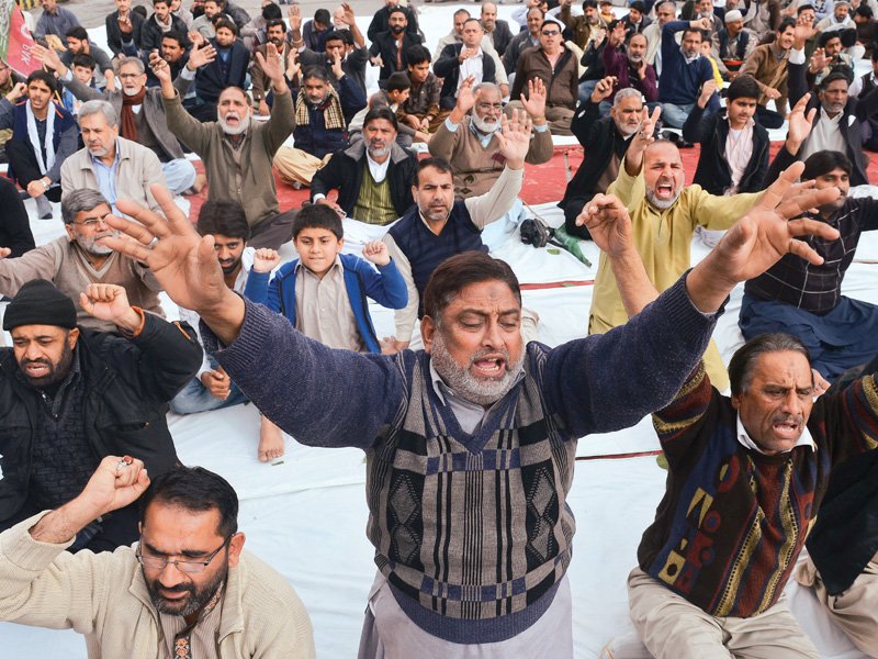 people shout slogans in lahore as they protest against bomb attack in quetta photo afp