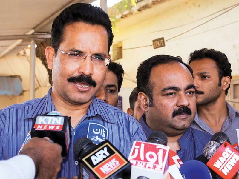 leaders of mqm khawaja izharul hassan and khalid bin wilayat talk to media persons after submitting resignations to sindh governor photo online