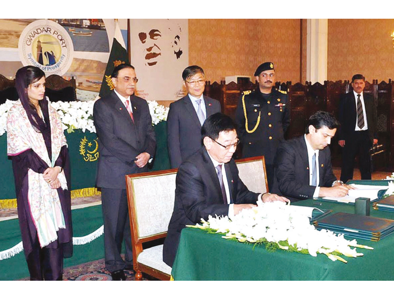 president asif zardari oversees the agreement signing between the port of singapore authority and the china overseas port holding company limited at the presidency photo app