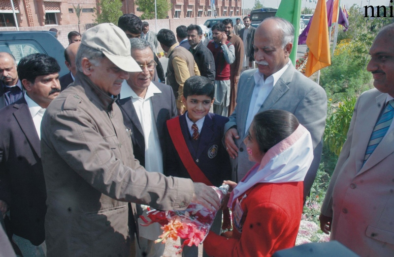 girl presenting flowers to cm punjab shahbaz sharif on his visit to rahim yar khan photo nni