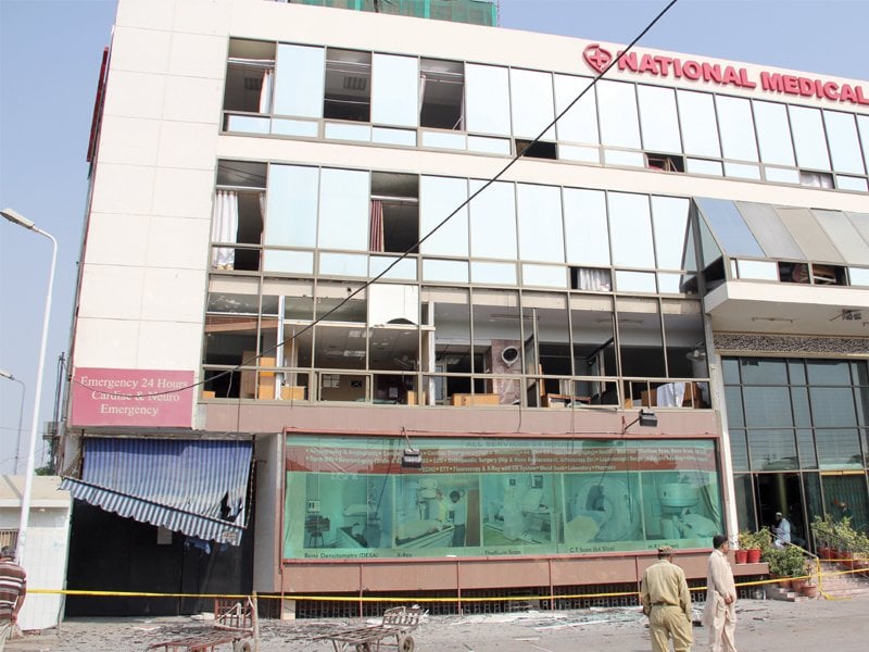 as smoke engulfed the first floor of the national medical centre the windows were broken so that people that people would not suffocate photo express