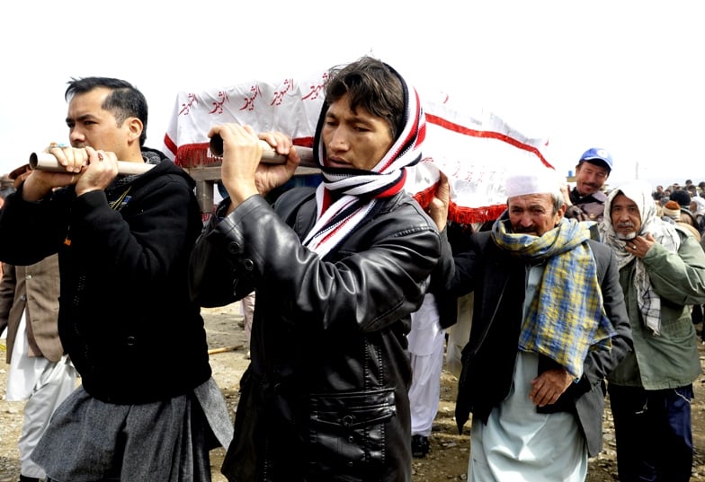 pakistani shia muslims carry the coffins of relatives during a mass burial ceremony in quetta on february 20 2013 photo afp