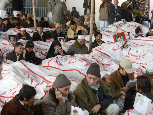 family members gather around bodies of their loved ones killed in a blast in quetta photo afp