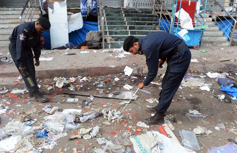 indian police search for clues at one of the blast sites at dilsukh nagar in hyderabad on february 22 2013 photo afp