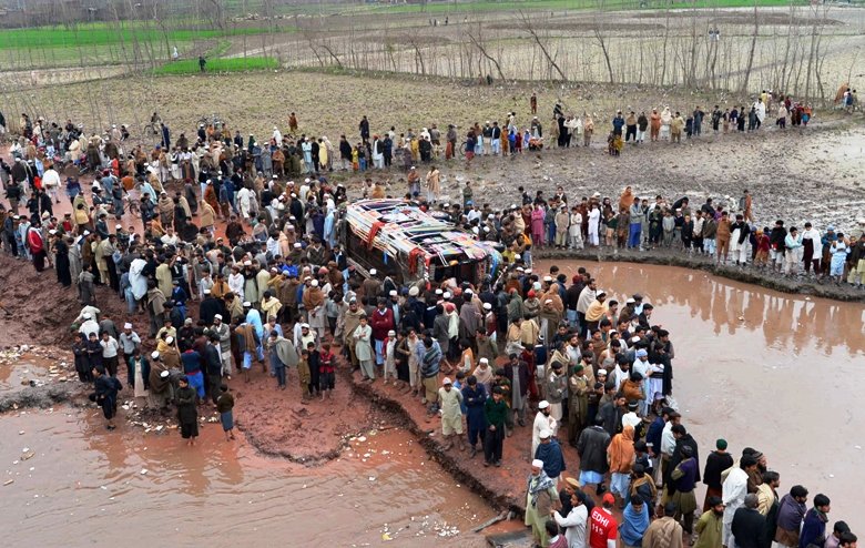 a photo showing the bus that fell in a canal near charsadda road photo afp