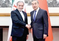 chinese foreign minister wang yi and iranian foreign minister abbas araqchi shake hands in beijing photo reuters