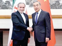 chinese foreign minister wang yi and iranian foreign minister abbas araqchi shake hands in beijing photo reuters
