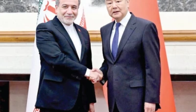 chinese foreign minister wang yi and iranian foreign minister abbas araqchi shake hands in beijing photo reuters