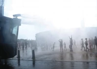 people enjoy water sprayed by a police water cannon in front of the olympic stadium during the ongoing heatwave in berlin photo reuters