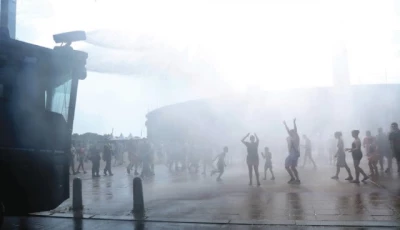 people enjoy water sprayed by a police water cannon in front of the olympic stadium during the ongoing heatwave in berlin photo reuters