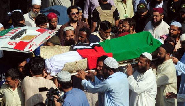 supporters of islamic party ahl i sunnat wal jamaat carry the coffin of an activist who was killed in a targeted killing in karachi on november 13 2012 photo afp supporters of islamic party ahl i sunnat wal jamaat carry the coffin of an activist who was killed in a targeted killing in karachi on november 13 2012 photo afp