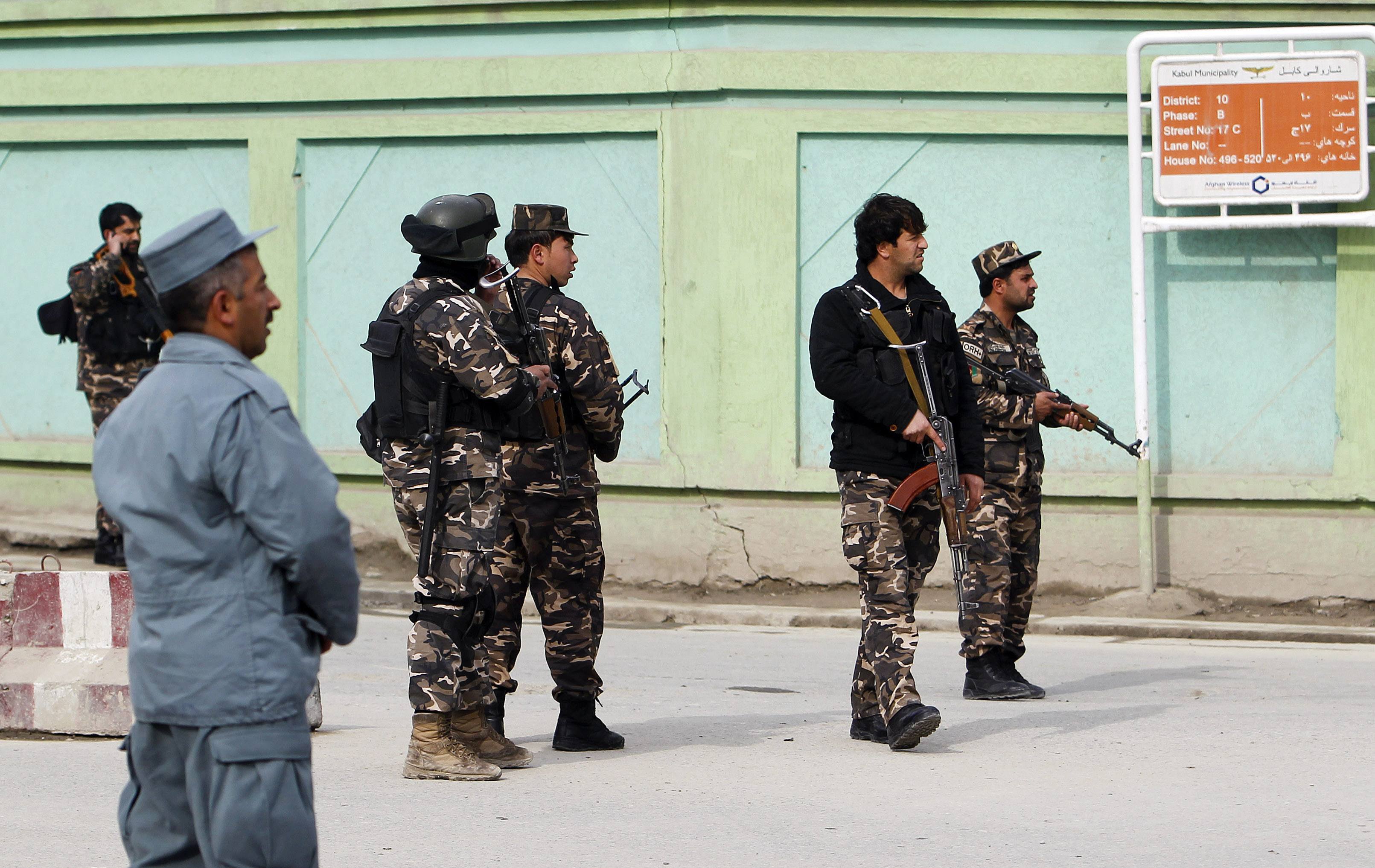 afghan security forces block the road near the side of an incident in kabul february 24 2013 photo afp