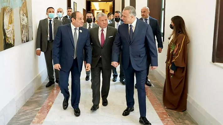 a handout picture released by iraq s prime minister s media office shows iraqi prime minister mustafa al kazemi r receiving egyptian president abdel fattah al sisi l and jordan s king abdullah ii in the capital baghdad on june 27 2021 photo afp