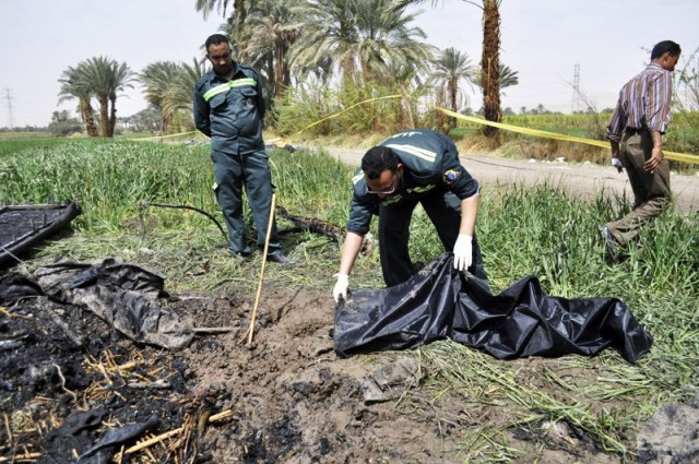 egyptian medics collect remains from the site of a hot air balloon accident in luxor on february 26 2013 photo afp egyptian medics collect remains from the site of a hot air balloon accident in luxor on february 26 2013 photo afp