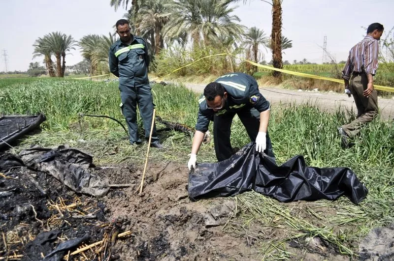 egyptian medics collect remains from the site of a hot air balloon accident in luxor on february 26 2013 photo afp egyptian medics collect remains from the site of a hot air balloon accident in luxor on february 26 2013 photo afp