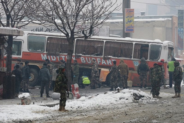 afghan national army ana soldiers investigate the scene following a suicide attack against a bus carrying afghan army personnel in kabul on february 27 2013 photo afp afghan national army ana soldiers investigate the scene following a suicide attack against a bus carrying afghan army personnel in kabul on february 27 2013 photo afp