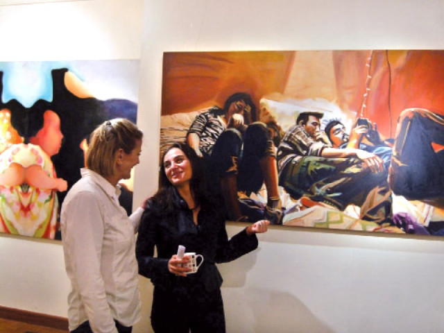 the artist discusses the paintings with fariba thomson photo muhammad javaid the artist discusses the paintings with fariba thomson photo muhammad javaid