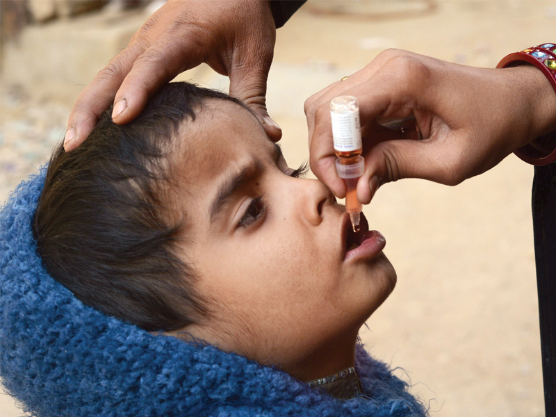 who working to reduce risk factors for those involved in work to tackle polio photo file