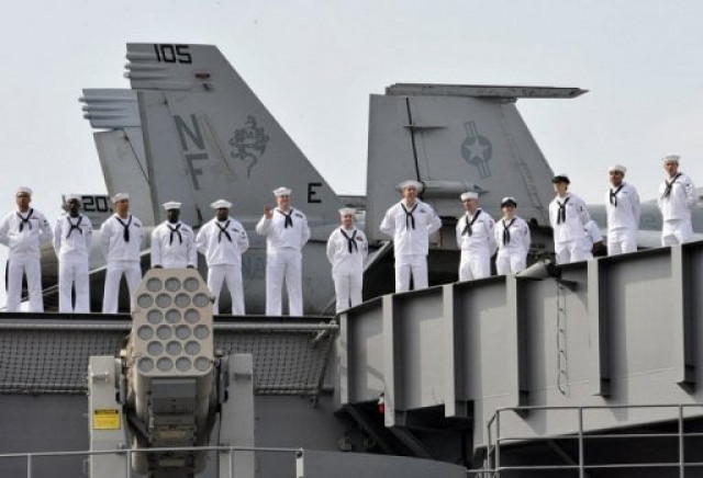 this file photo shows crew members of a us aircraft carrier lining up on the upper deck of the vessel upon their arrival at the yokosuka us naval base on september 25 2008 photo afp this file photo shows crew members of a us aircraft carrier lining up on the upper deck of the vessel upon their arrival at the yokosuka us naval base on september 25 2008 photo afp