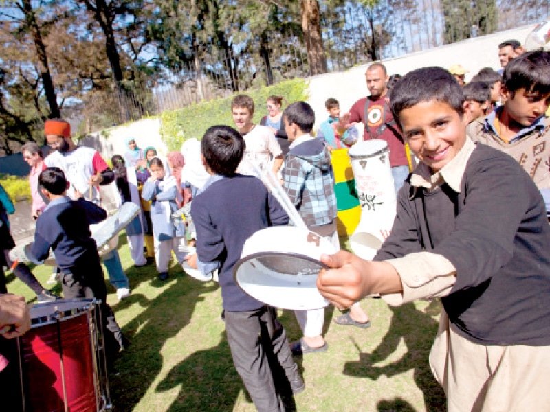 kids listening and dancing to patubat s music at the workshop photo myra iqbal