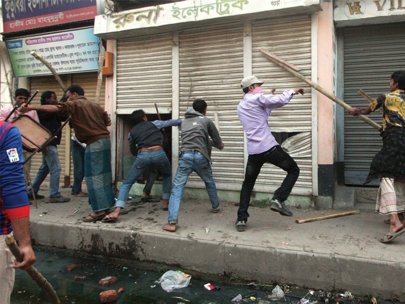 bangladeshi activists vandalise shops during clashes with police in bogura some 120kms north of dhaka photo afp