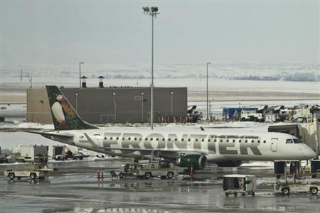 a frontier airlines jet waits at the gate prior to departure at the denver international airport in denver colorado photo reuters