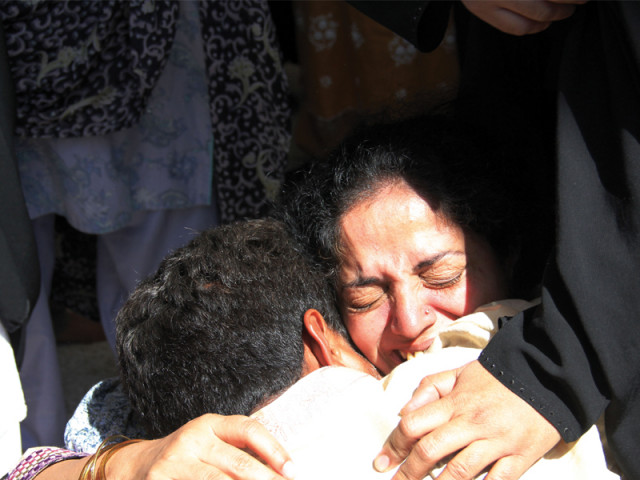 two relatives hug each other at the imambargah in ancholi as they mourn the loss of their loved ones two relatives hug each other at the imambargah in ancholi as they mourn the loss of their loved ones