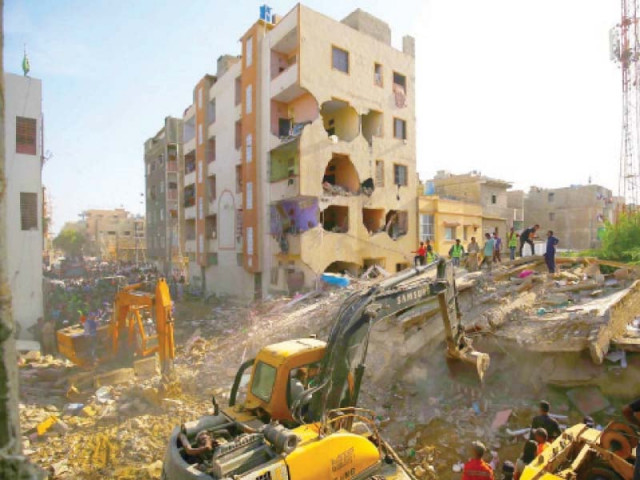 rescue teams work to find those trapped in the rubble after a residential building collapsed in allahwala town at least one teenager was killed while rescue efforts continue photo inp rescue teams work to find those trapped in the rubble after a residential building collapsed in allahwala town at least one teenager was killed while rescue efforts continue photo inp