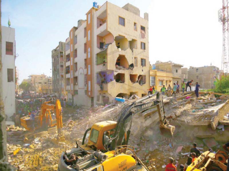 rescue teams work to find those trapped in the rubble after a residential building collapsed in allahwala town at least one teenager was killed while rescue efforts continue photo inp