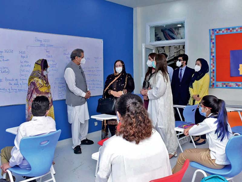 education minister shafqat mehmood interacts with teachers and students at a school in islamabad on the first day of the reopening of educational institutions photo nni