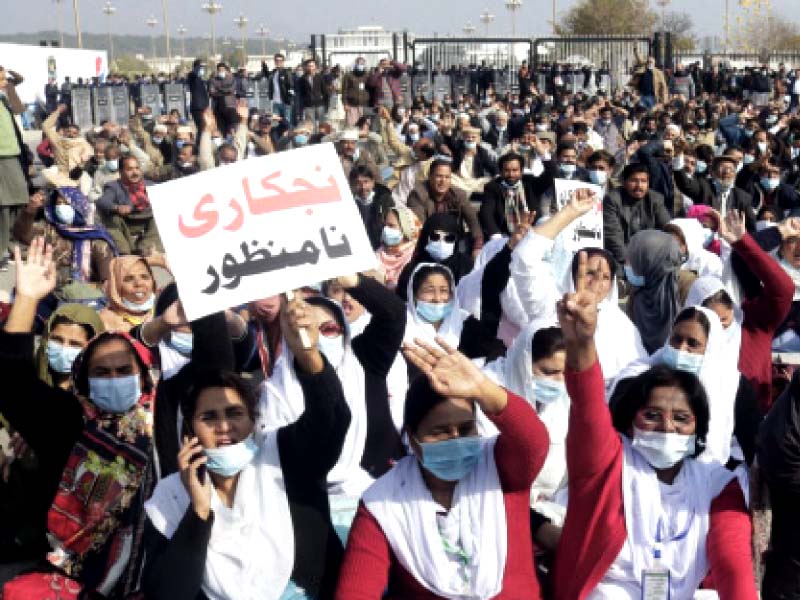 pims employees chant slogans during a protest against mti act at d chowk on monday photo express