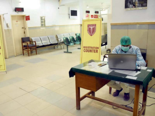 a staff member works on a laptop computer at the registration counter of the newly established coronavirus vaccination centre at polyclinic in islamabad on saturday photo online a staff member works on a laptop computer at the registration counter of the newly established coronavirus vaccination centre at polyclinic in islamabad on saturday photo online