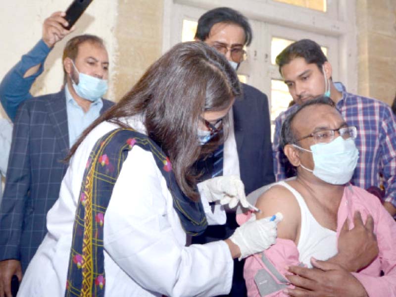 the inoculation of healthworkers in sindh began on wednesday with the first shot of the sinopharm vaccine being adminis tered to dr tanveer ahmed at the dow university of health sciences ojha campus photos jalal qureshi express