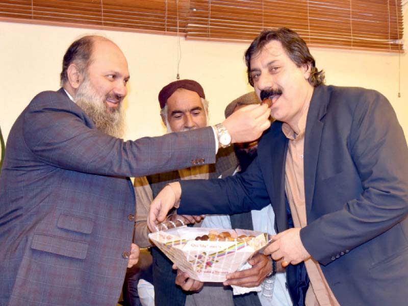 balochistan and khyber pakhtunkhwa chief ministers jam kamal and mahmood khan celebrate the senate election victory with party members photo express