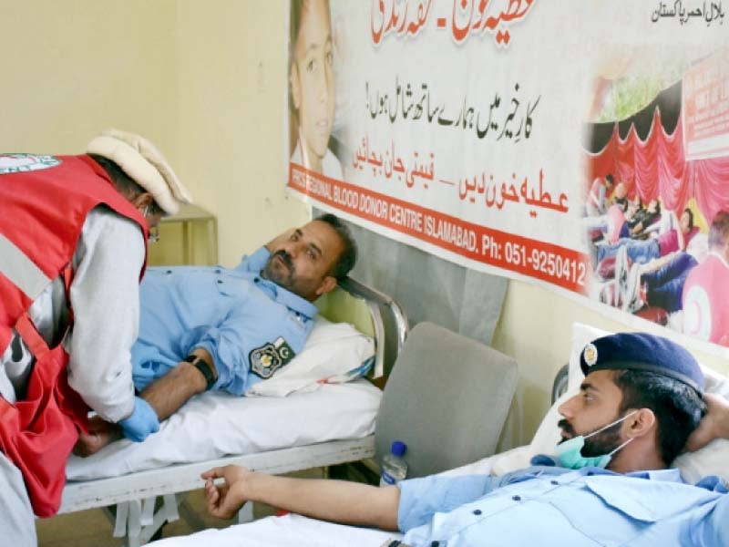 policemen donate blood for thalassemia patients at a camp set up at police lines headquarters photo express