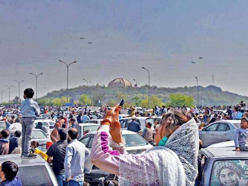 citizens gather at zero point to witness a spectacular display of aerobatics by the pakistan air force during a military parade held to commemorate pakistan day photo online