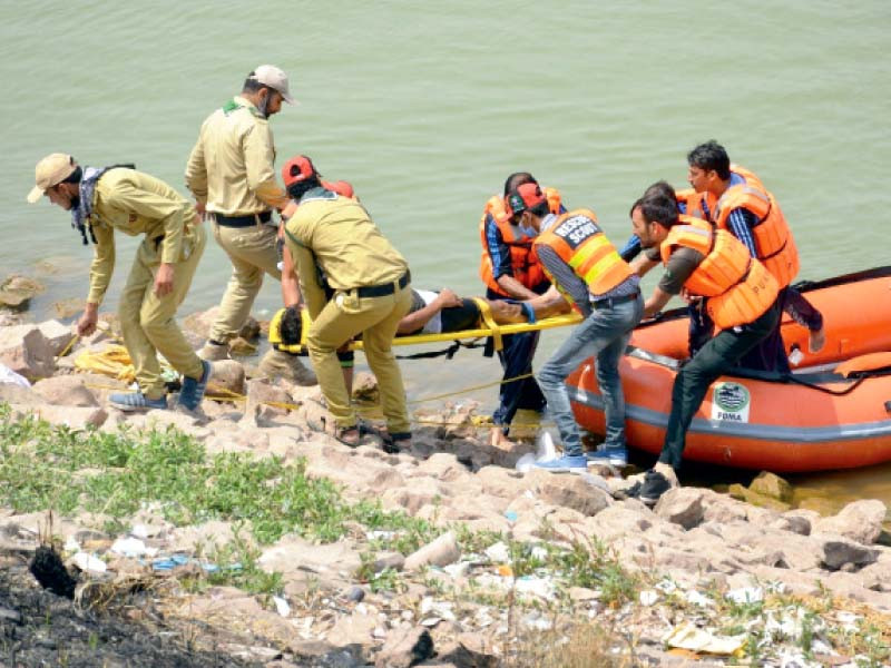 a team conducts a mock drill at rawal dam to assess preparations for rescue operation in case of possible floods during the monsoon photo express