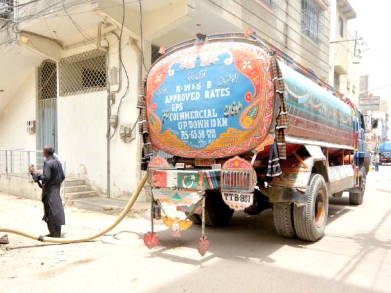 a private water tanker supplies water to residents as acute water shortage is being witnessed photo jalal qureshi express